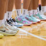 Basketball players wearing matching custom team socks