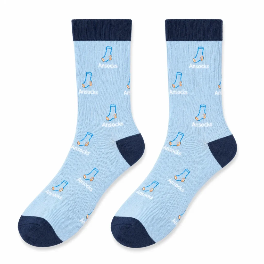Pair of light blue custom knitted logo socks with navy cuffs heels and toes