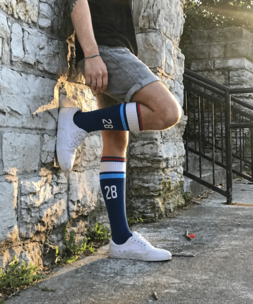 Athlete wearing custom number 28 over the calf athletic socks outdoors