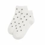 Pair of cream custom ankle dress socks with small brown floral patterns on a white background.