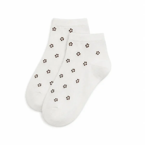 Pair of cream custom ankle dress socks with small brown floral patterns on a white background.