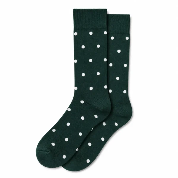 Pair of custom forest green crew dress socks with small white polka dots on a white background.