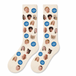 Pair of cream custom photo socks with family faces, pet portraits, and logo print on a white background.
