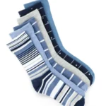 Six pairs of women's crew dress socks in blue, gray, and striped designs on a white background.