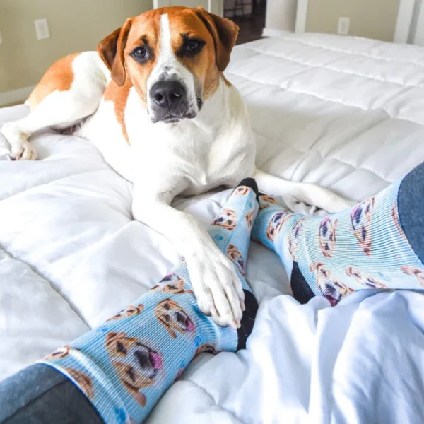 Person wearing cream custom photo socks printed with family faces and pet portraits.