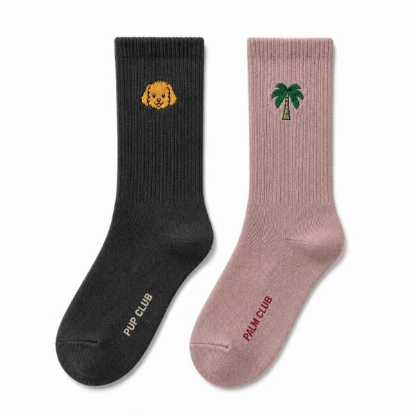 Black and dusty rose custom embroidered crew socks with dog and palm tree logos.